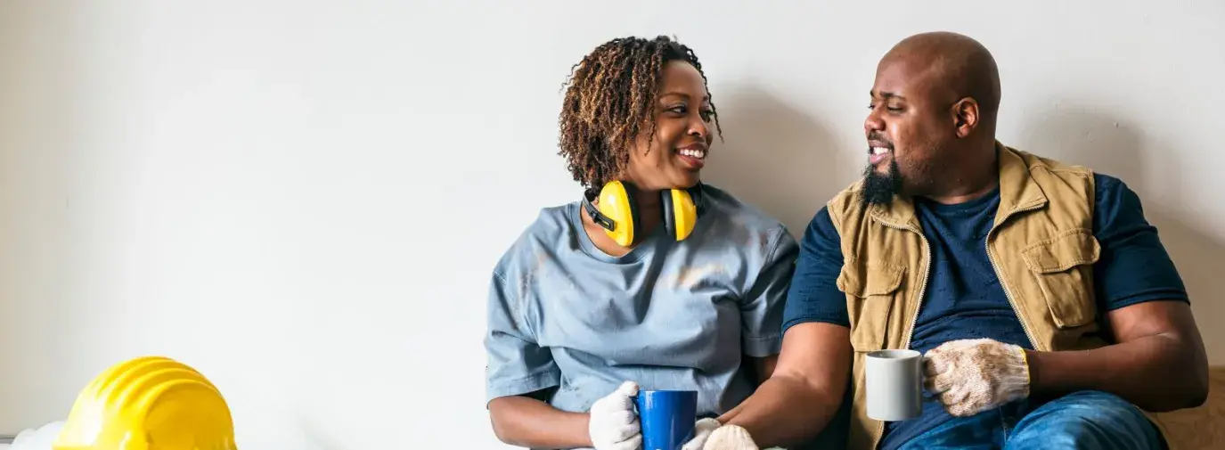 An African American couple taking a break during a home rennovation.
